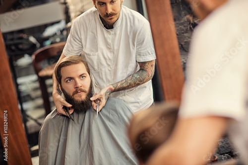 Barber man grooming of real hipster.