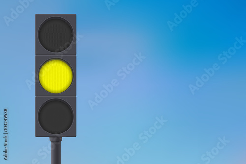 Traffic lights with yellow light on.