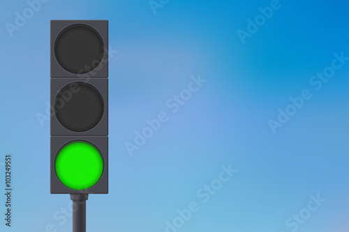 Traffic lights with green light on.