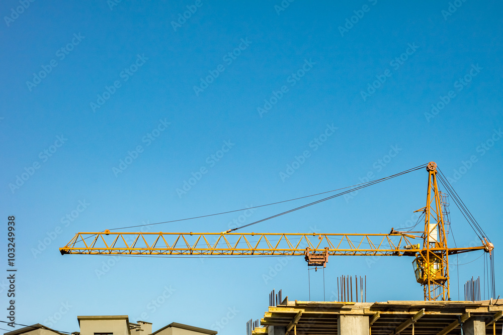 Building under construction and crane.