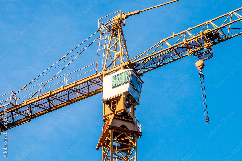 Construction. Crane. Blue sky.
