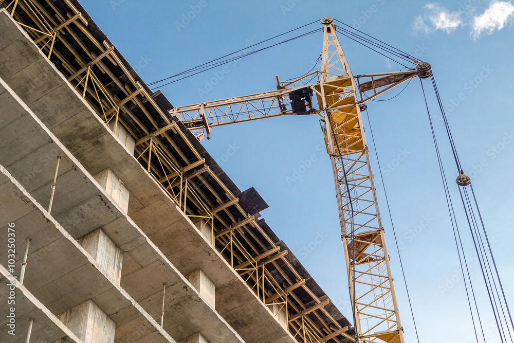 Building under construction and crane. Building under construction and crane.