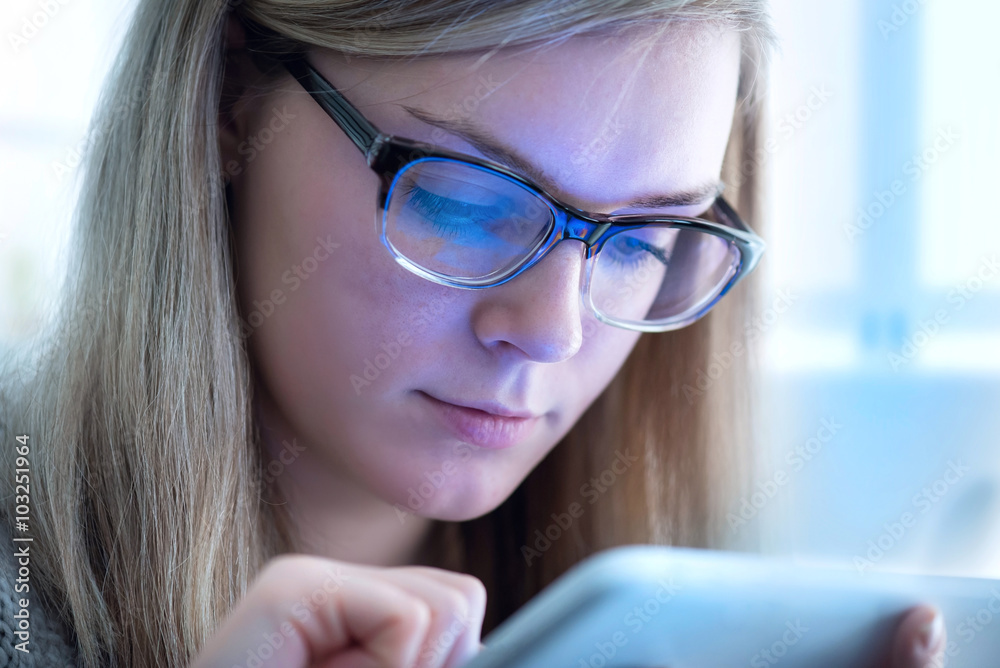 Young girl works on the tablet on the internet Young girl works on the tablet on the internet