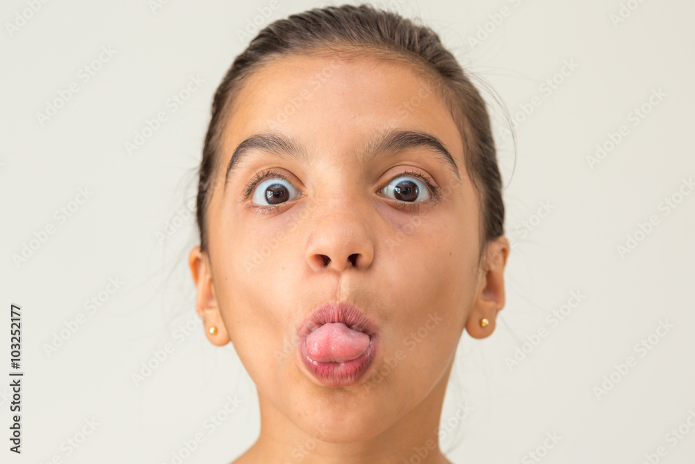 Young gril showing tongue Young gril showing tongue