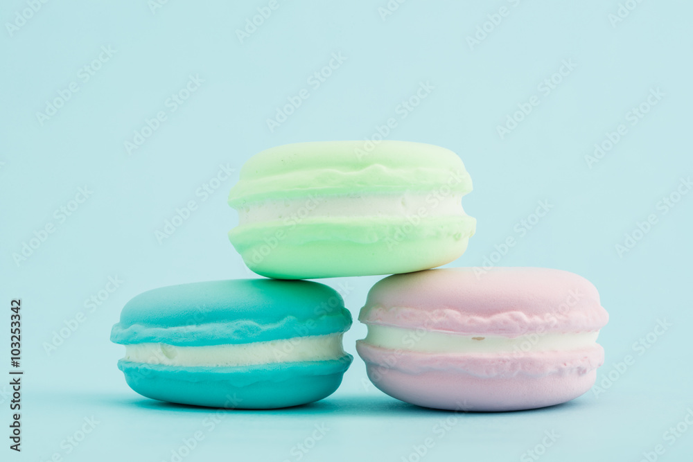 French colorful macarons stacks on pastel background