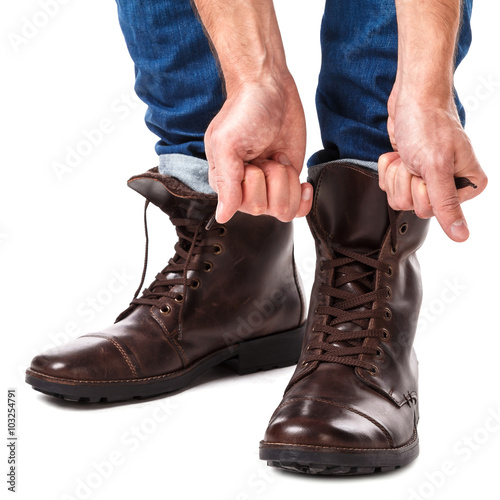 Man lacing shoes