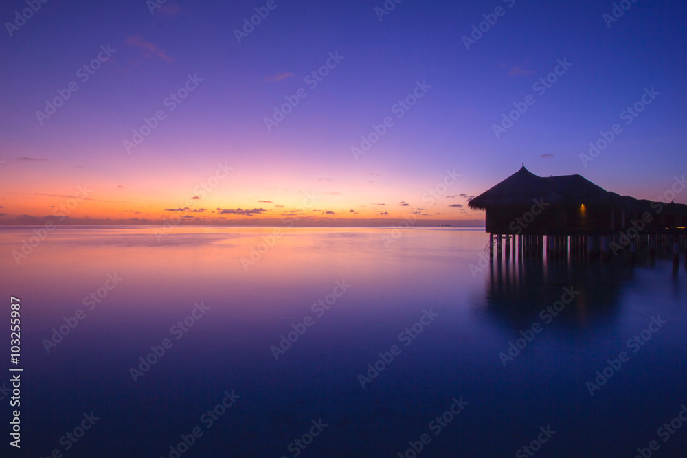 TWO SKY'S NEXT TO WATER BUNGALOW. Few clouds on the sky and a flat sea conditions, crate a beautiful sunset like this.