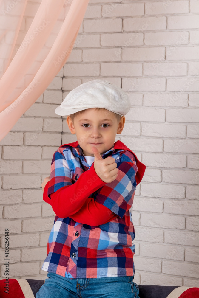 boy in a cap shows class boy in a cap shows class