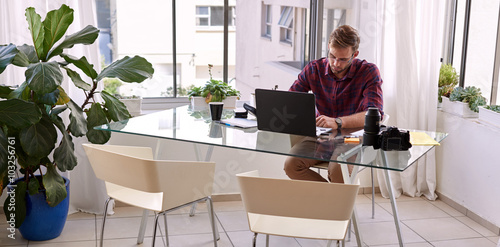 Businessman busy working from his desk at home