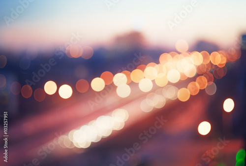 Blurred defocused lights of traffic in the city photo