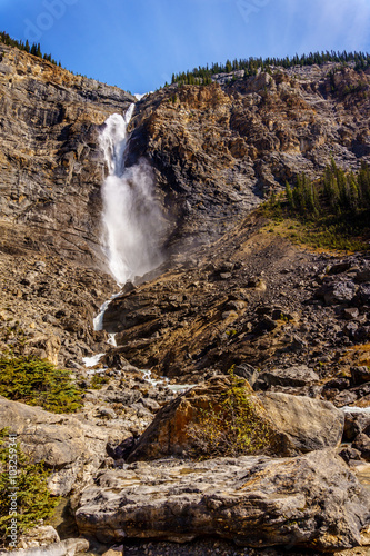 Takakkaw Falls in Yoho National Park in the Rocky Mountains. Plunging from above at a height of 380m (1246 ft ) with a 254m ( 833 ft ) free-fall, Canada's second highest waterfall