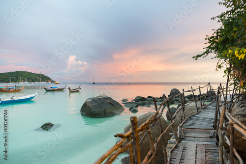 Wood bridge with sunset at pattaya beach in Koh Lipe Island
