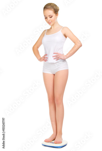 Young healthy girl on scales