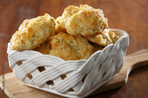 Basket full of cheddar cheese biscuits photo