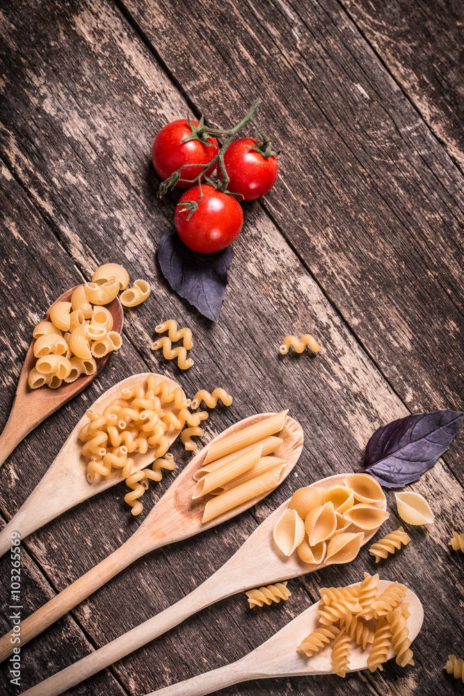 Various mix of pasta on wooden rustic background. Diet and food Various mix of pasta on wooden rustic background. Diet and food