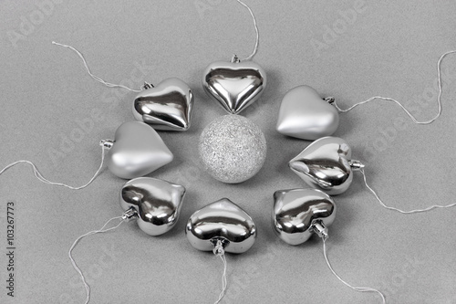 metaphorical view of fertilization presented with Christmas toys, silver ball and hearts simulating egg and sperm