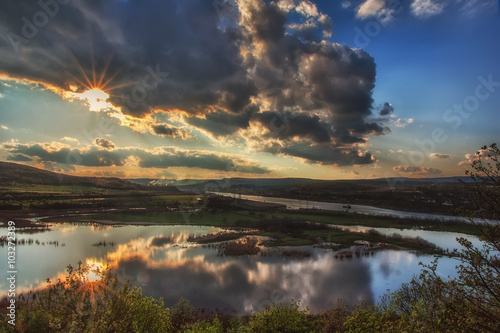 Sunset view at the lake with reflections