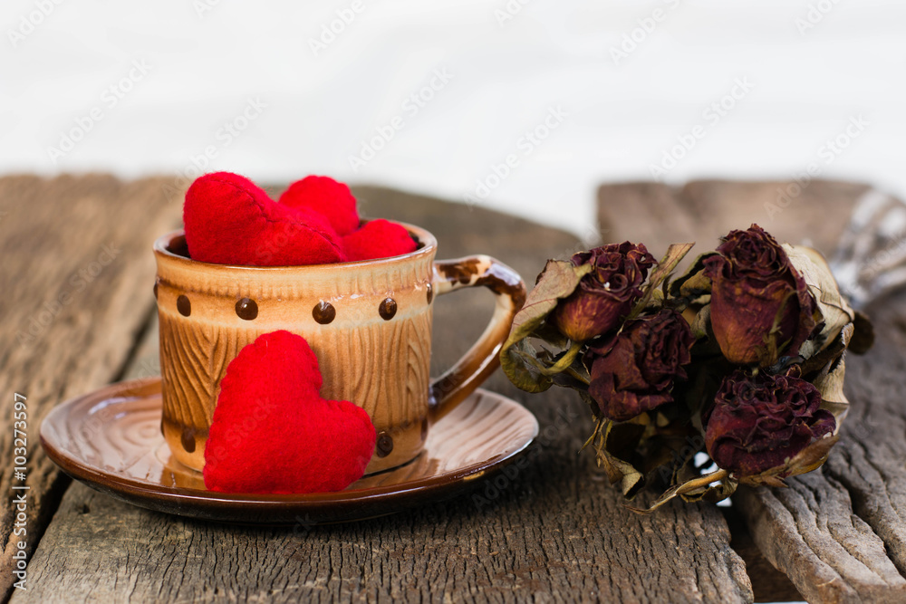 Red heart on a glass coffee set on old wooden Red heart on a glass coffee set on old wooden