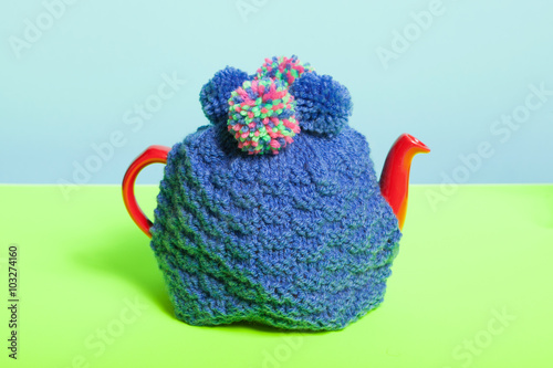 Photos Teapot with knitted cosy.