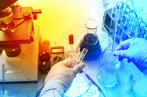 science laboratory test tubes with periodic table background