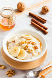 oatmeal porridge with banana, nuts and honey