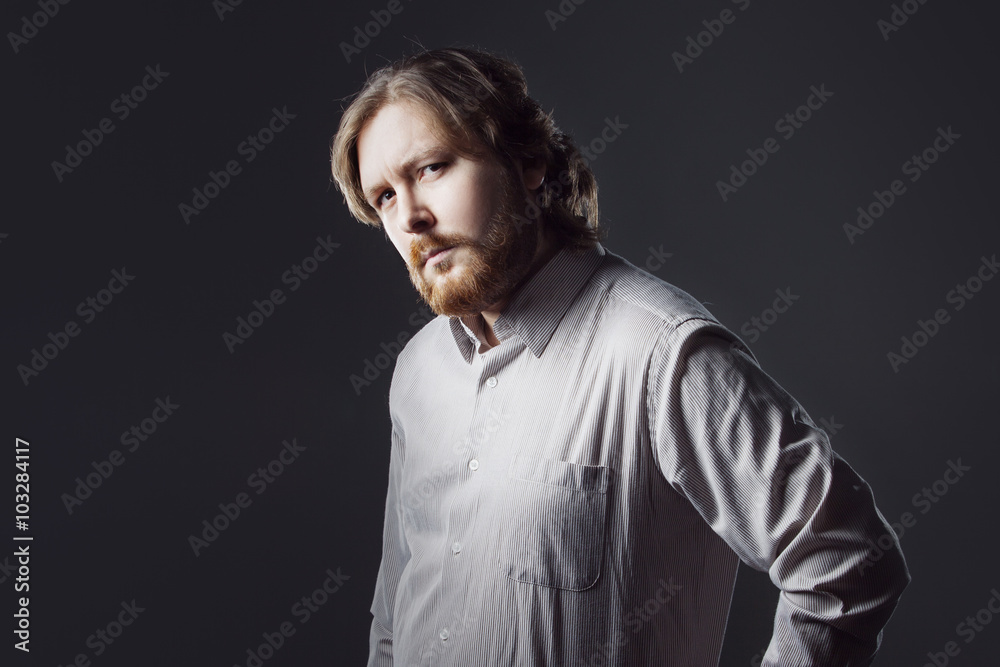 bearded young man with surprised expression