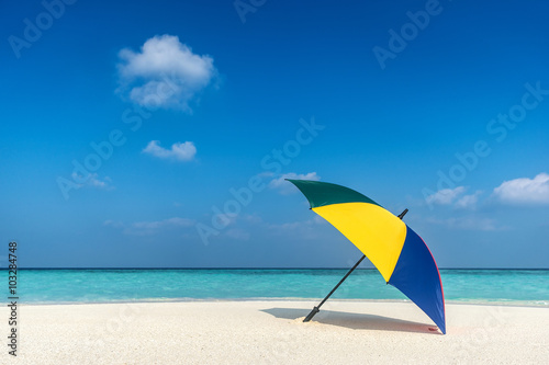 Beach umbrella on a sunny day  sea in background
