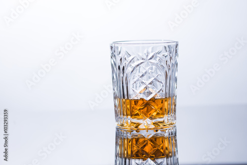 whiskey on the rocks on glass table