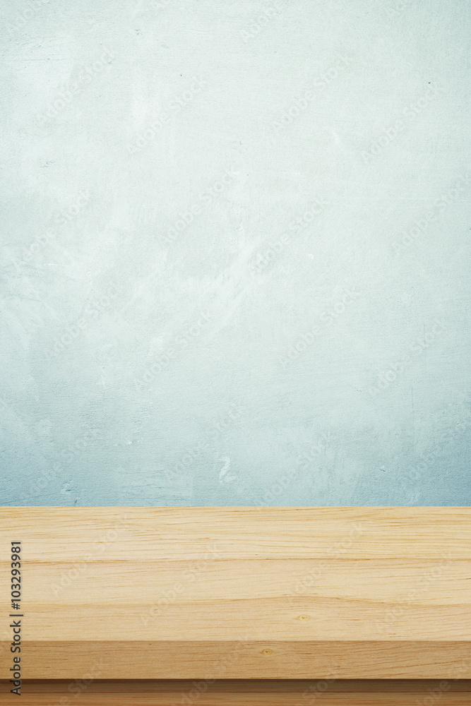 Empty wooden table over grunge cement wall background Empty wooden table over grunge cement wall background