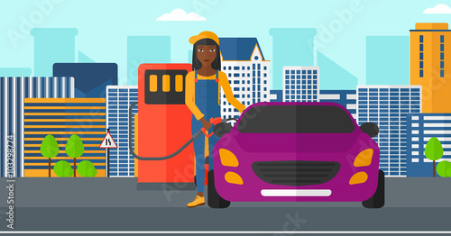 Woman filling up fuel into car.