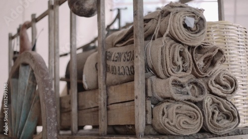 Wooden old transportation car with jute sacks of coffee photo