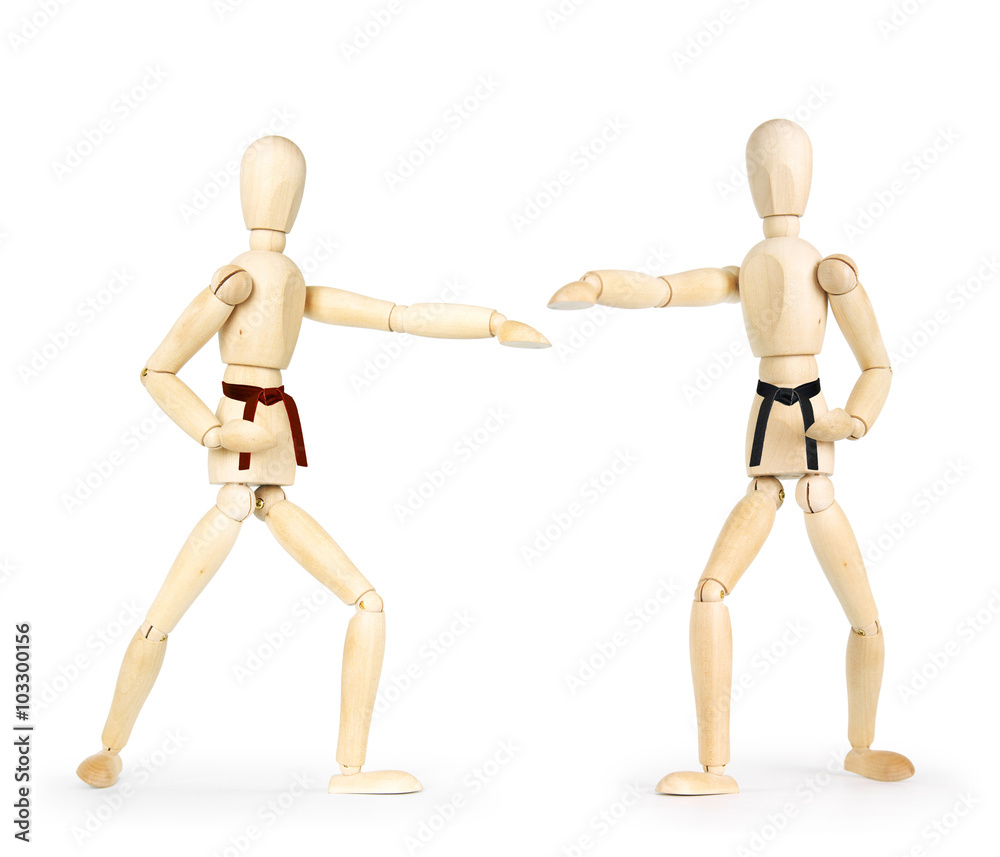Two karate men are fighting. Abstract image with wooden puppets Two karate men are fighting. Abstract image with wooden puppets