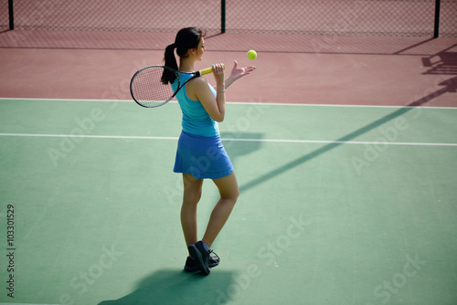 Young beautiful woman tennis player practice in tennis court