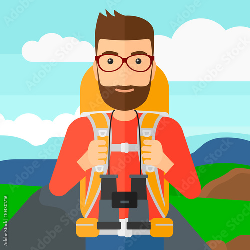 Cheerful backpacker with binoculars.