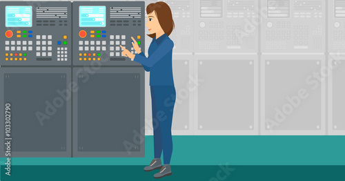 Engineer standing near control panel.