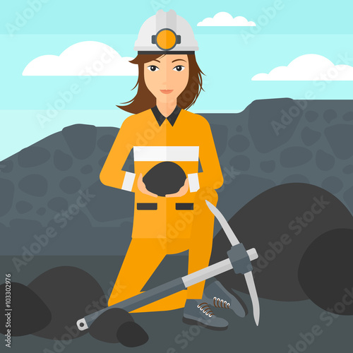 Miner holding coal in hands.