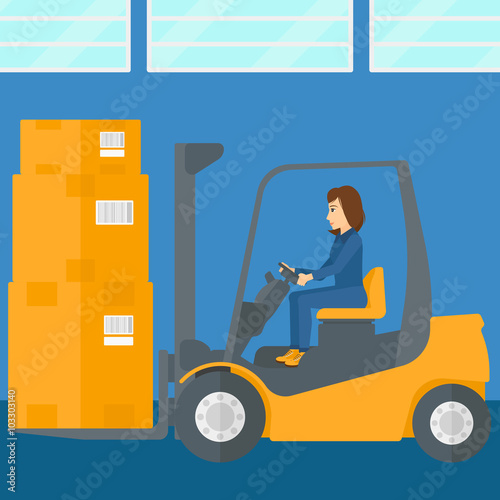 Warehouse worker moving load by forklift truck.