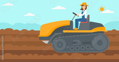 Farmer driving catepillar tractor.