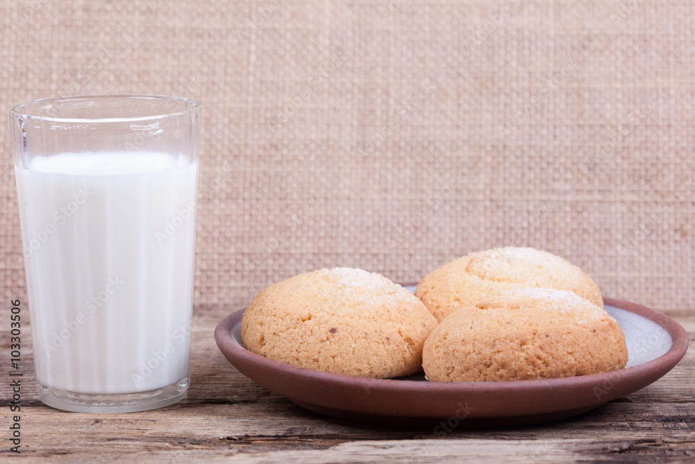 glass of milk and cookies in the saucer still life glass of milk and cookies in the saucer still life
