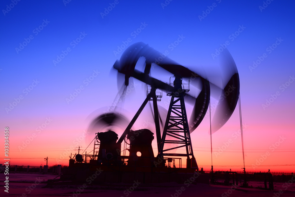 The beam pumping unit is homework, in the fields under the setti The beam pumping unit is homework, in the fields under the setti