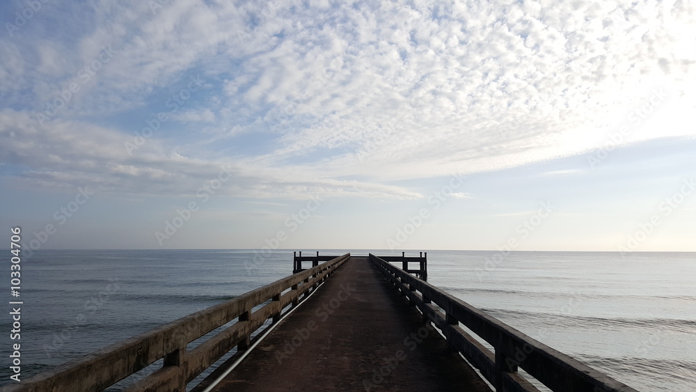 jetty with view of sea and sky in the morning light