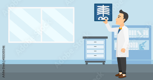 Doctor examining radiograph.