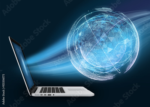 Laptop with digital globe against dark background. The absorption of planet