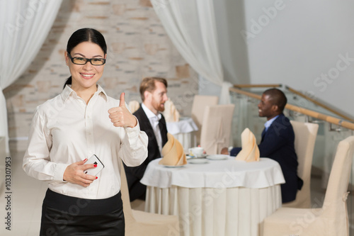 Business woman showing thumb-up