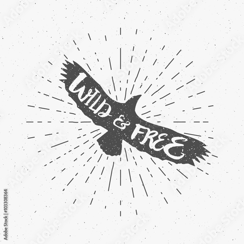 Vintage eagle with hand drawn lettering slogan. Retro silhouette monochrome animal design with inspirational typography. Motivation text. Wild and free style. Sunburst. Vector illustration