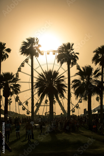 Ferris Wheel Sunset. Ferris wheel in Coachella California caught in a sand storm at sunset.