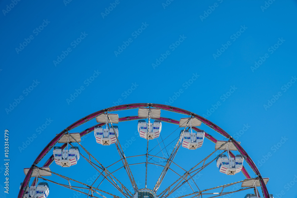 Old Carnival Ferris Wheel with Clean Skies. Close up shot of half of a ferris wheel in Coachella California. Old Carnival Ferris Wheel with Clean Skies. Close up shot of half of a ferris wheel in Coachella California.