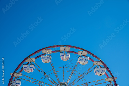 Old Carnival Ferris Wheel with Clean Skies. Close up shot of half of a ferris wheel in Coachella California.