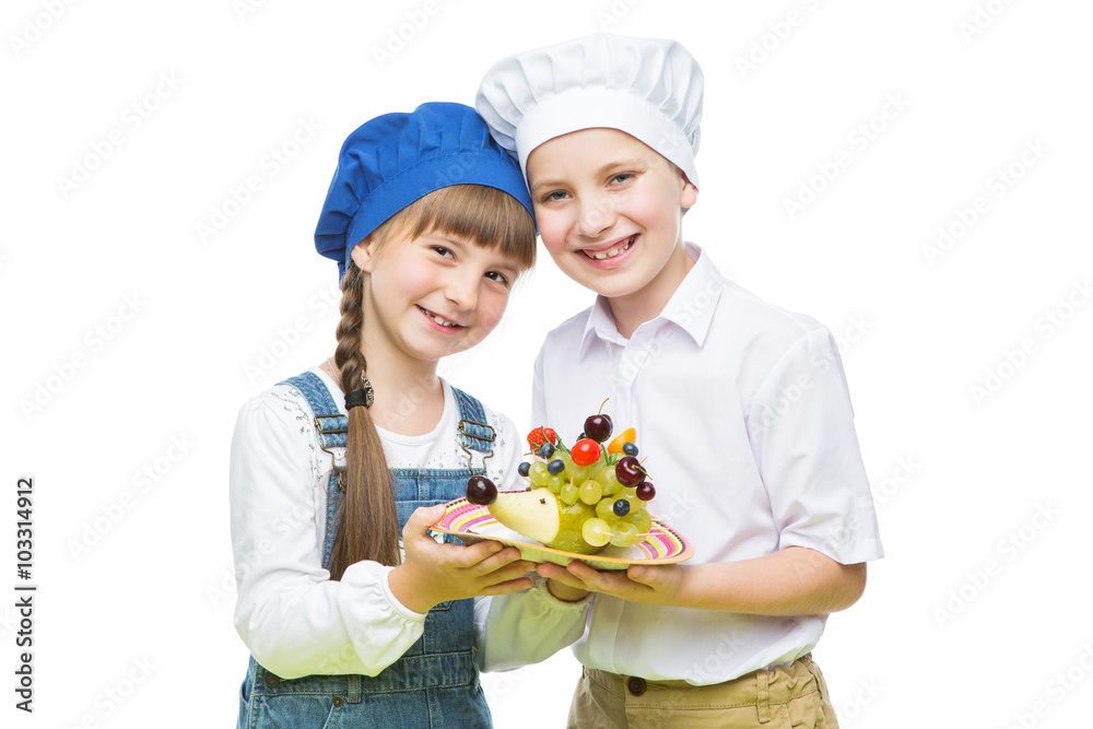 Children holding hedgehog shape fruit snack Children holding hedgehog shape fruit snack