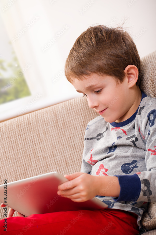 boy playing with digital tablet boy playing with digital tablet